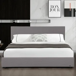 Lit coffre Juva rembourré avec velours côtelé 140 x 200 cm gris><noscript><img width=